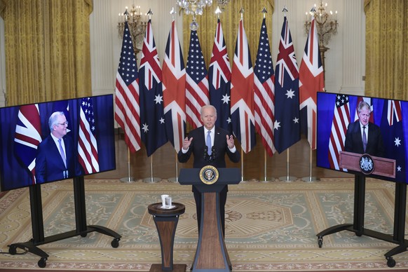 epa09470736 US President Joe Biden delivers remarks about a national security initiative in the East Room of the White House in Washington, DC, USA, 15 September 2021. Australian Prime Minister Scott  ...