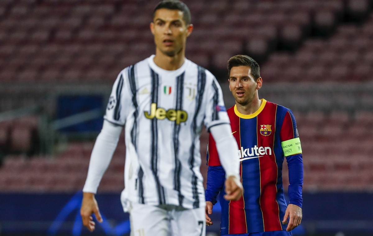 Barcelona's Lionel Messi, right, and Juventus' Cristiano Ronaldo during the Champions League group G soccer match between FC Barcelona and Juventus at the Camp Nou stadium in Barcelona, Spai ...