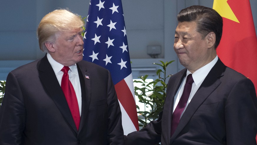 FILE - In this July 8, 2017, file photo, U.S. President Donald Trump, left, and China&#039;s President Xi Jinping arrive for a meeting on the sidelines of the G-20 Summit in Hamburg, Germany. Trump is ...