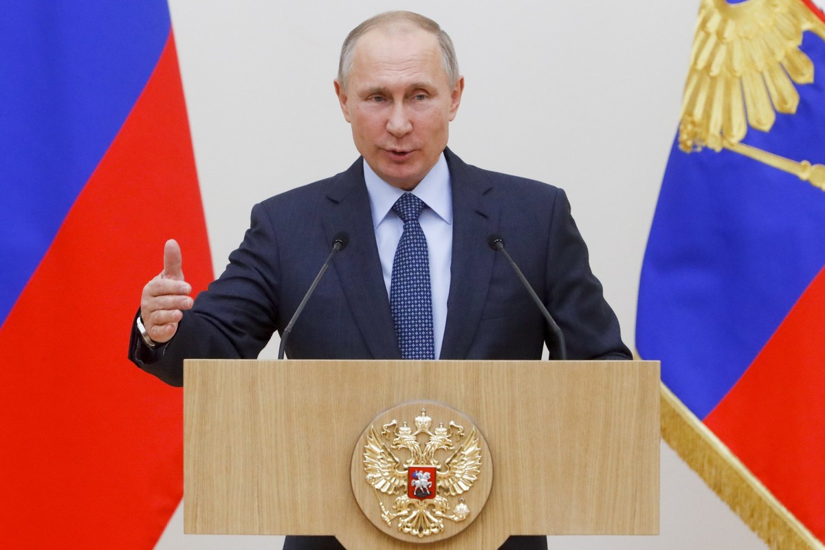 FILE - In this Thursday, Dec. 7, 2017 file photo, Russian President Vladimir Putin gestures while speaking to employees of Rostec Corporation during an awarding ceremony at the Novo-Ogaryovo state res ...