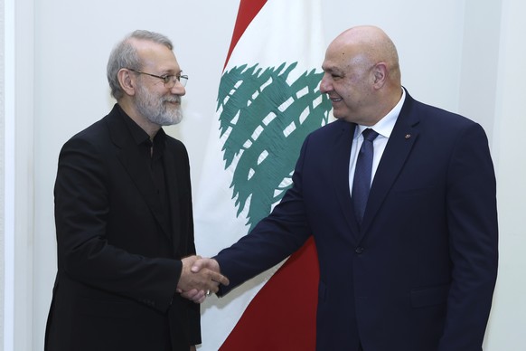 In this photo, released by the Lebanese Presidency press office, Lebanese President Joseph Aoun, right, shakes hands with Iranian Secretary of Supreme National Security Council Ali Larijani, at the pr ...