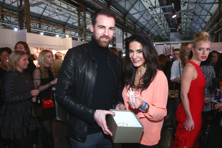 DUESSELDORF, GERMANY - JANUARY 29: Christoph Metzelder and Mariella Ahrens attend the Breuninger show during Platform Fashion January 2016 at Areal Boehler on January 29, 2016 in Duesseldorf, Germany. ...