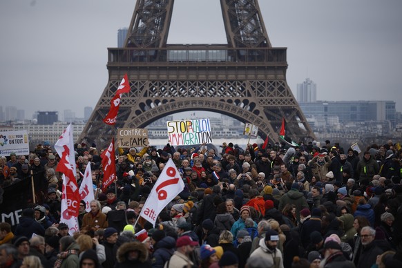 epa11094311 People gather in a demonstration organised by collectives of undocumented immigrants, unions, and left-wing parties, against the government&#039;s proposed new immigration laws, in Paris,  ...