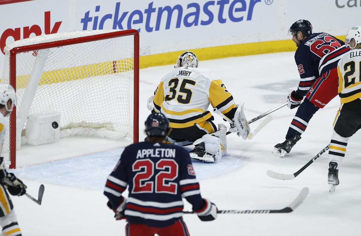 Winnipeg Jets' Nino Niederreiter (62) scores on Pittsburgh Penguins goaltender Tristan Jarry (35) during the first period of an NHL hockey game Saturday, Feb. 10, 2024, in Winnipeg, Manitoba. (Jo ...