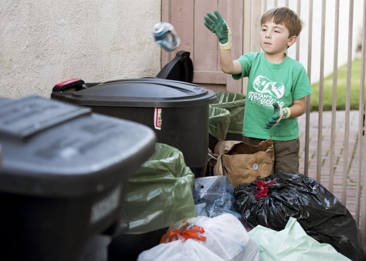 Ryan Hickman, 7, sorts recyclables he's collected from his neighbors in San Juan Capistrano, CA on Tuesday, February 28, 2017.