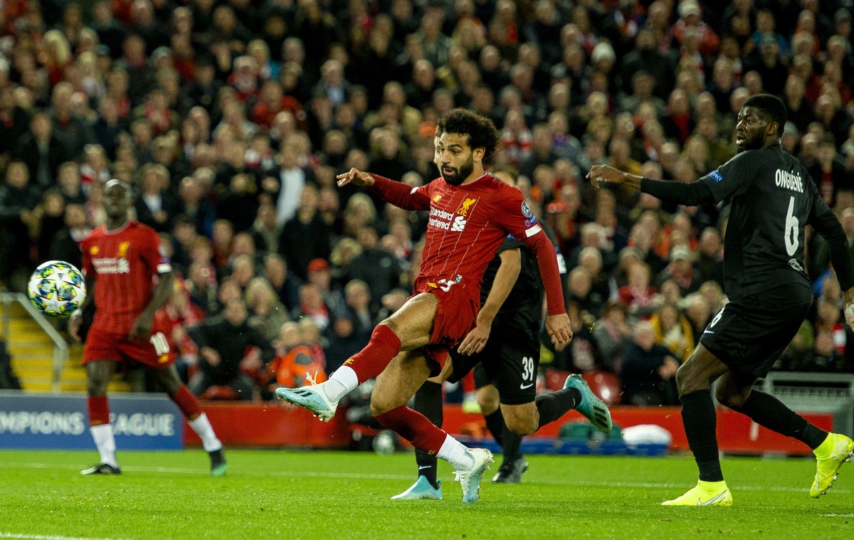 epa07890501 Liverpool's Mohamed Salah (C) scores the 4-3 goal during the UEFA Champions League Group E soccer match between Liverpool FC and FC Salzburg held at the Anfield in Liverpool, Britain, ...