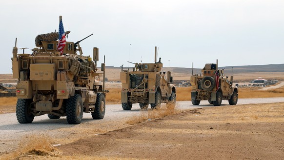 epa07936944 A convoy of US troops head toward the Iraqi borders in northeastern of Syria, 20 October 2019. Media reported the US troops started their withdrawal from north Syria towards Iraq according ...