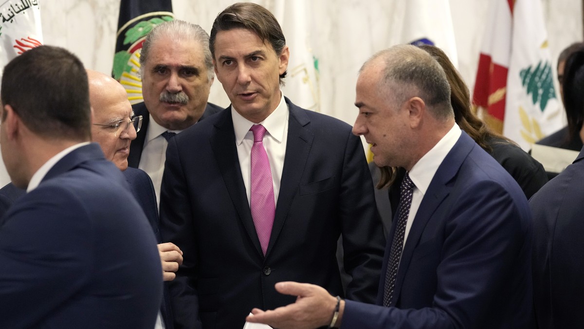 U.S. Envoy for Energy Affairs Amos Hochstein, lcenter, speaks to Lebanese deputy prime minister Elias Bou Saab, right, who leads the Lebanese negotiations team, after their meeting with the Lebanese P ...