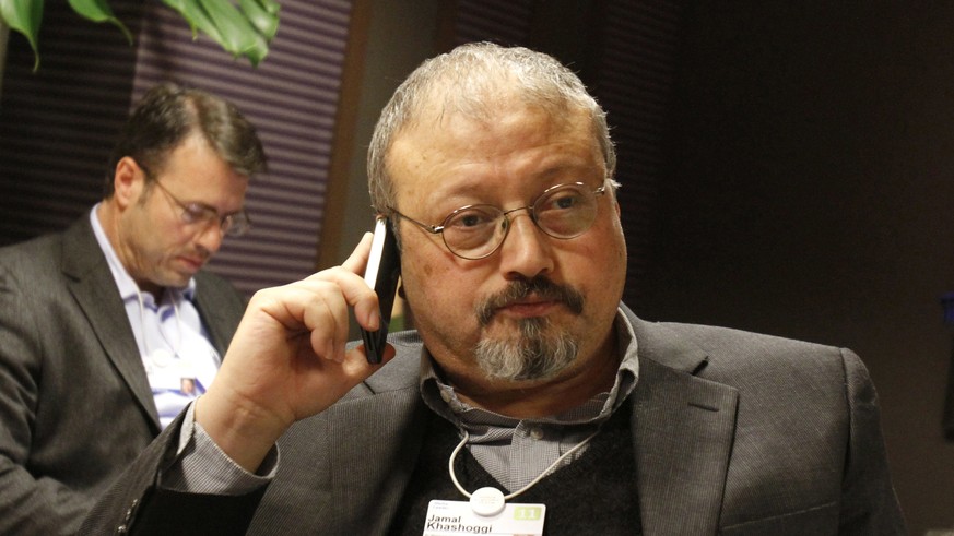 FILE - In this Jan. 29, 2011, file photo, Saudi Arabian journalist Jamal Khashoggi speaks on his cellphone at the World Economic Forum in Davos, Switzerland. Saudi Arabia issued an unusually strong re ...