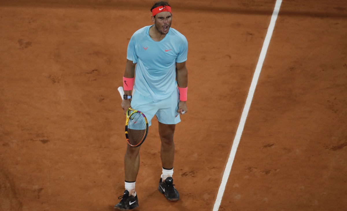 Spain's Rafael Nadal celebrates winning his quarterfinal match of the French Open tennis tournament against Italy's Jannik Sinner in three sets, 7-6 (7-4), 6-4, 6-1, at the Roland Garros sta ...