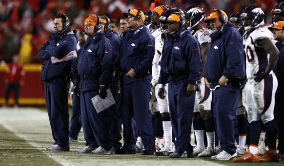 epa05688343 Denver Broncos coaching staff watches from the sidelines in the second half of the NFL football game between the Denver Broncos and the Kansas City Chiefs on Christmas day at Arrowhead Sta ...