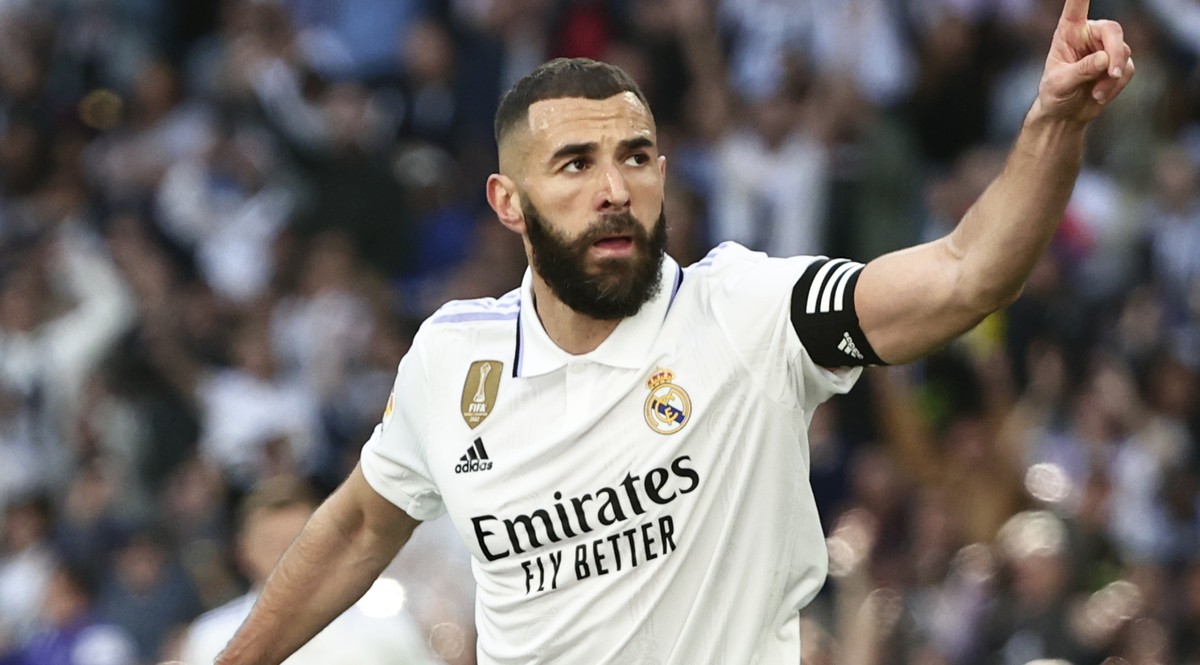 Real Madrid's Karim Benzema celebrates after scoring his side's third goal during a Spanish La Liga soccer match between Real Madrid and Valladolid at the Santiago Bernabeu stadium in Madrid ...