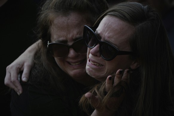 Relatives of Sgt. Yam Goldstein and her father, Nadav, cry during their funeral in Kibbutz Shefayim, Israel, Monday, Oct. 23, 2023. Yam and her father were killed by Hamas militants on Oct. 7 at their ...