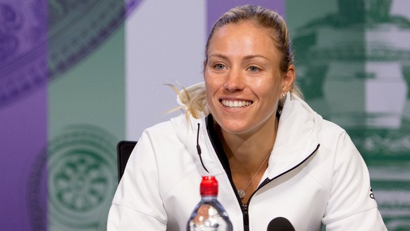 epa06059629 A handout photo made available by the AELTC showing Angelique Kerber of Germany giving a press conference at The All England Lawn Tennis Club, London, Britain, 01 July 2017. The 2017 Wimbl ...