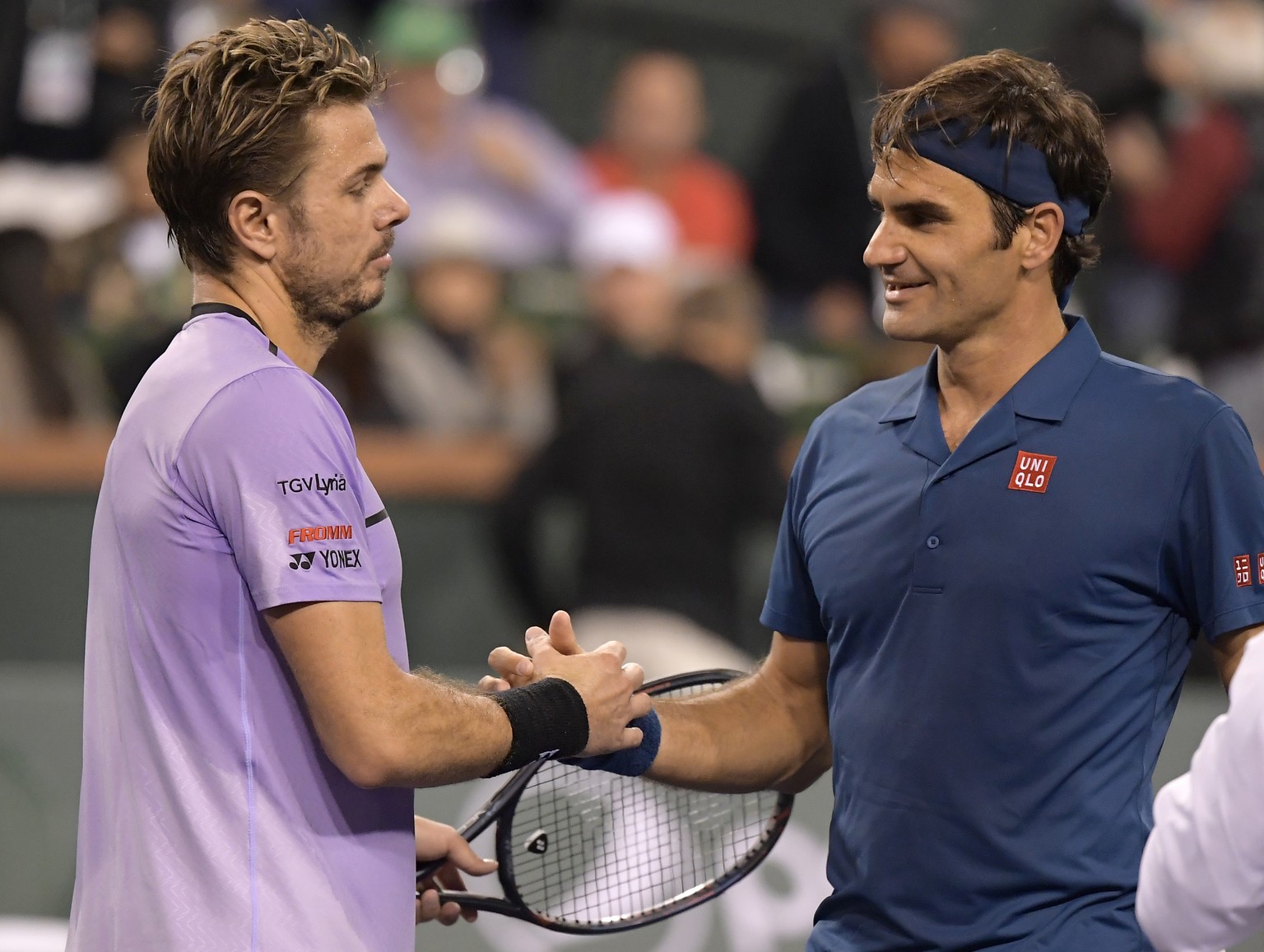 Stan Wawrinka left, congratulates Roger Federer at the BNP Paribas Open tennis tournament Tuesday, March 12, 2019 in Indian Wells, Calif. (AP Photo/Mark J. Terrill)