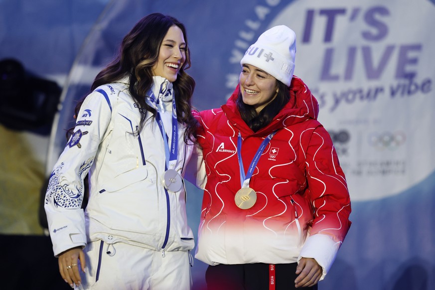 Mathilde Gremaud of Switzerland, gold medal winner of the women's Freestyle Skiing Freeski slopestyle competition, right, and silver medal winner Ailing Eileen Gu of China, during the Champions c ...