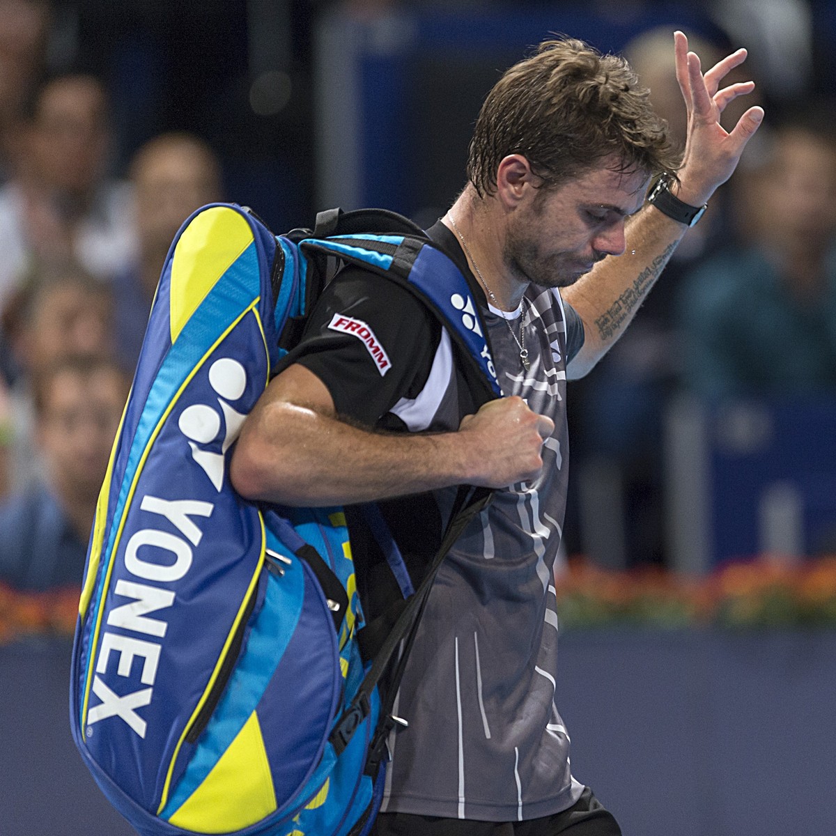 Switzerland's Stanislas Wawrinka leaves the center court after losing his first round match against Kazakhstan's Mikhail Kukushkin at the Swiss Indoors tennis tournament at the St. Jakobshal ...