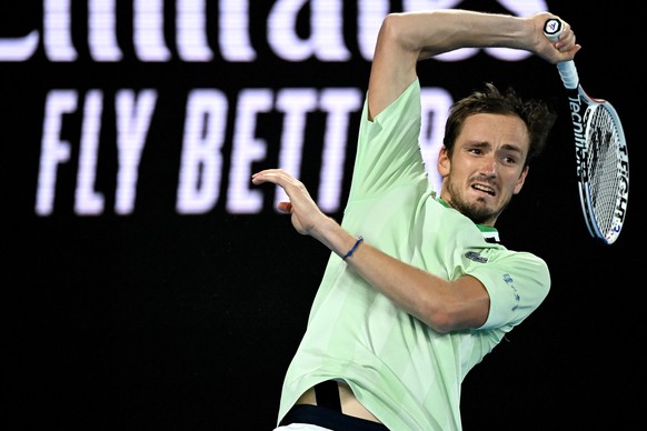 epa09713978 Daniil Medvedev of Russia in action against Stefanos Tsitsipas of Greece during their men&#039;s semi final match of the Australian Open Grand Slam tennis tournament at Melbourne Park in M ...