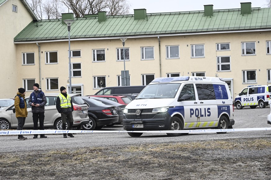 epa11255223 Polioce at the scene of a school shooting in Vantaa, Finland, 02 April 2024. Three children aged twelve have been wounded in a shooting at the school, police said. The suspect, also aged 1 ...
