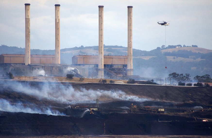 In this Feb. 25, 2014, photo provided by the Incident Control Centre, a fire burns at the Hazelwood Coal Mine at Morwell, Australia. Victoria state Chief Health Officer Rosemary Lester said Friday, Fe ...