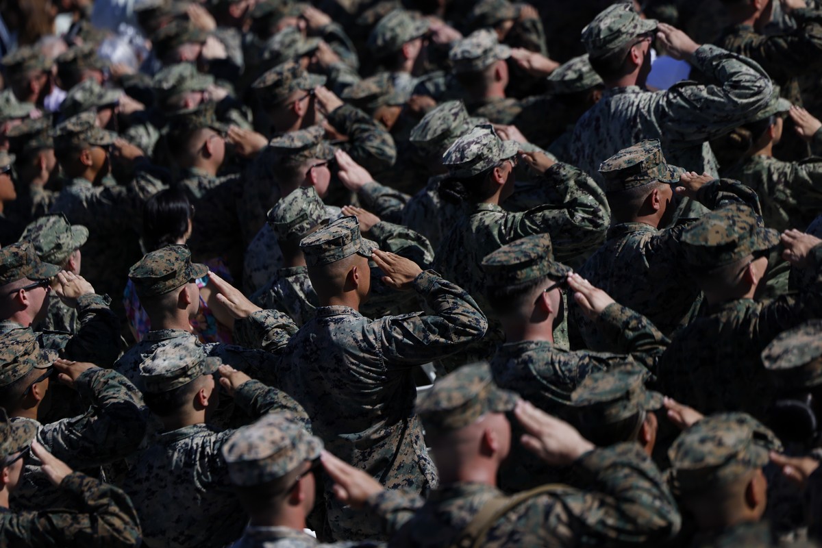 epa12463604 US Marines salute during the 'America's Marines 250: From Sea to Shore-A Review of Amphibious Strength' event, part of the celebrations marking the U.S. Marine Corps 250th a ...