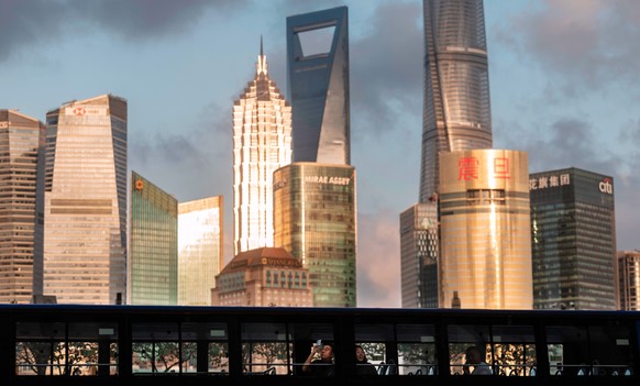 epa11633547 People ride a bus ahead of the celebrations of the 75th anniversary of the founding of the People&#039;s Republic of China, in Shanghai, China, 30 September 2024. On 01 October 2024, China ...