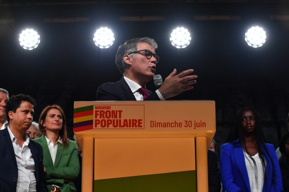 epa11449040 Olivier Faure (PS) gestures while speaking during the New Popular Front Rally after the first round of the early parliamentary elections at Place de la Republique in Paris, France, 30 June ...