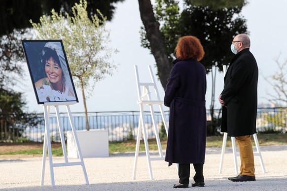 epa08804049 Relatives pay a tribute during a ceremony for the victims of the recent attack at Notre-Dame de Nice Basilica, in Nice, France, 07 November 2020. Three people were killed on 29 October whe ...