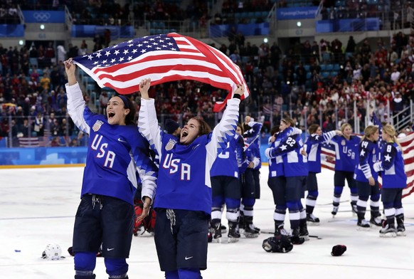 FILE - United States players celebrate after winning the women&#039;s gold medal hockey game against Canada at the 2018 Winter Olympics in Gangneung, South Korea, Feb. 22, 2018. The United States is t ...
