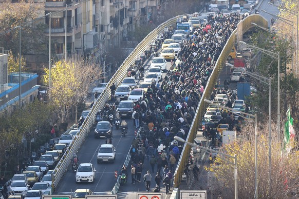 FILE - Protesters march on a bridge in Tehran, Iran, on Dec. 29, 2025. (Fars News Agency via AP, File)
Iran Protests Explainer