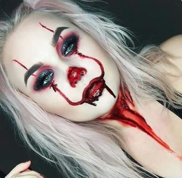 Horror clown makeup including a slit throat.
