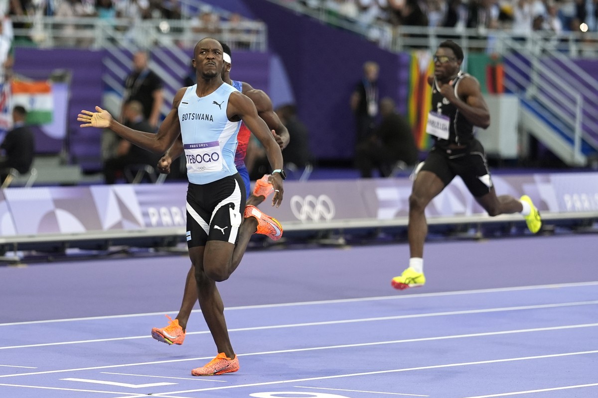 Letsile Tebogo, of Botswana, celebrates after winning the men's 200-meter final at the 2024 Summer Olympics, Thursday, Aug. 8, 2024, in Saint-Denis, France. (AP Photo/Matthias Schrader)
