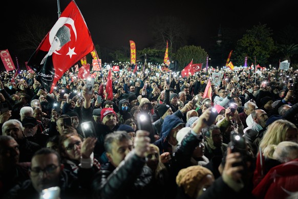 Supporters of Turkey's main opposition Republican People's Party or (CHP) listen to speeches during a rally, in Istanbul, Wednesday, March 18, 2026, marking the first anniversary of the arre ...