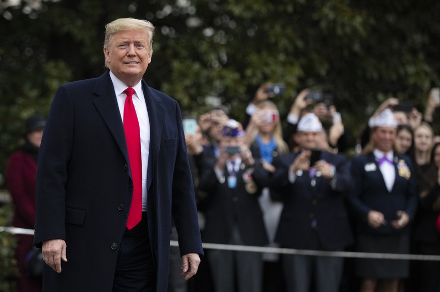 President Donald Trump speaks to the members of the media before leaving the White House, Monday, Jan. 13, 2020, in Washington, for a trip to watch the College Football Playoff national championship g ...