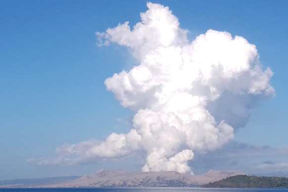 Taal Volcano spews white steam and ash as seen from Balete, Batangas province, south of Manila, Philippines on Saturday March 26, 2022. A small Philippine volcano in a scenic lake near the capital bel ...