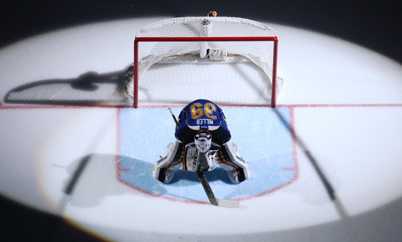 The spotlights shine on St. Louis Blues goaltender Ryan Miller during player introductions before an NHL hockey game between the St. Louis Blues and the Tampa Bay Lightning, Tuesday, March 4, 2014 in  ...