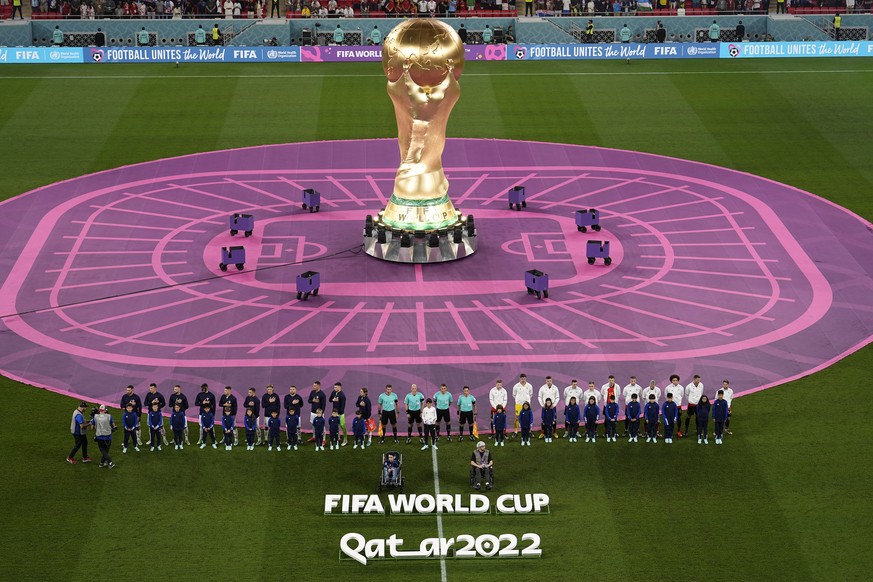 Players gather on the field for a pregame ceremony prior to the World Cup group F soccer match between Croatia and Belgium at the Ahmad Bin Ali Stadium in Al Rayyan, Qatar, Thursday, Dec. 1, 2022. (AP ...