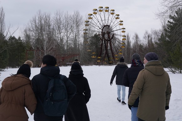 February 6, 2022, Pripyat, Chernobyl Exclusion Zone, Ukraine: Tourists visit an amusement park that never opened in the abandoned city of Pripyat in the Chernobyl Exclusion Zone on February 6, 2022 in ...