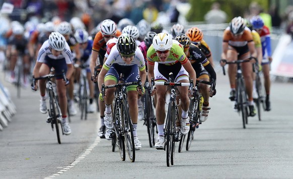 Netherlands' Marianne Vos, center right, sprints to the finish line to win stage three of the Women's Tour of Britain, Clacton, England, Friday, May 9, 2014. (AP Photo/PA, Gareth Fuller) UNITED KINGDO ...