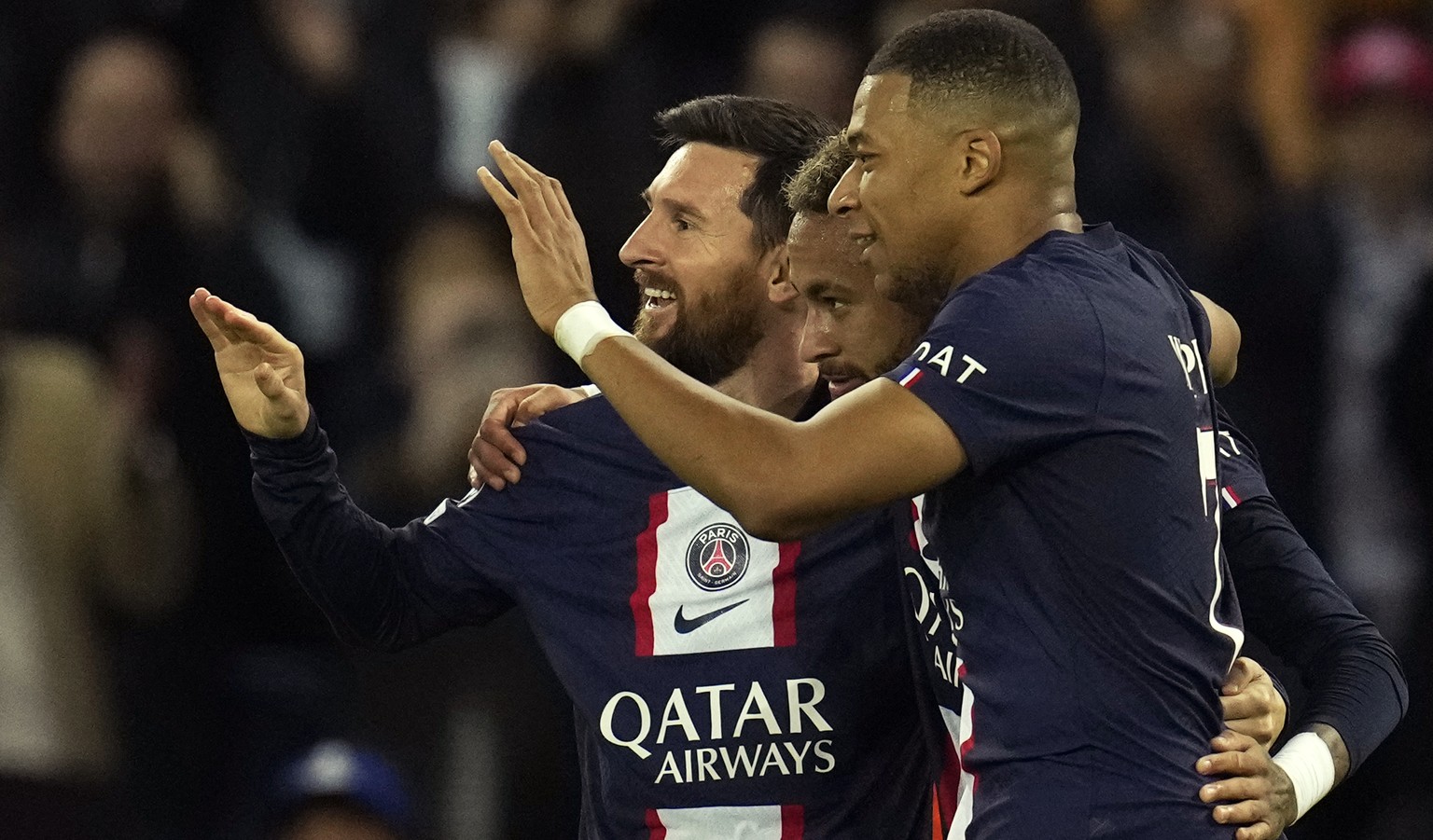PSG&#039;s Neymar, center, celebrates PSG&#039;s Lionel Messi, left, and PSG&#039;s Kylian Mbappe, right, after scoring his side&#039;s third goal during the Champions League Group H soccer match betw ...