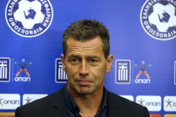 The new national soccer team coach Michael Skibbe of Germany makes statements after signing a contract with the Greek football association in Athens, Friday, Oct. 30, 2015. The 50-year-old former Scha ...