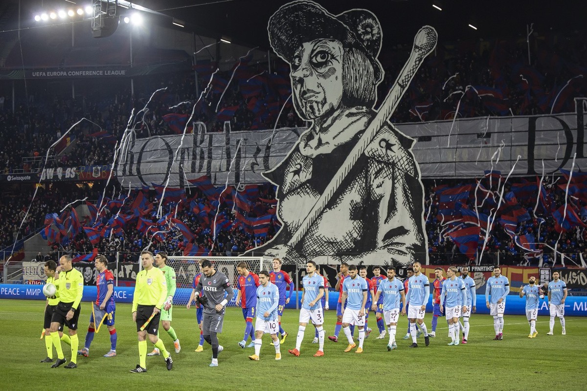 Teams and match officials walk onto the pitch before the UEFA Europa Conference League play-off second leg soccer match between Switzerland's FC Basel 1893 and Turkey's Trabzonspor at the St ...