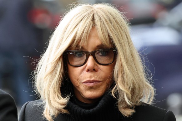 epa12523028 French President&#039;s wife Brigitte Macron arrives outside La Belle Equipe, one of the sites targeted in the November 2015 Paris attacks, for a ceremony in tribute to the victims, in Par ...