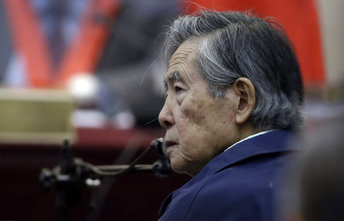 FILE - Peru's former President Alberto Fujimori listens to a question during his testimony in a courtroom at a military base in Callao, Peru, March 15, 2018. The South American country ?s Constit ...