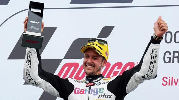 epa05524378 Swiss rider Thomas Luethi of Derendinger Interwetten Team celebrates on the podium, during the Moto2 race of the 2016 British Motorcycling Grand Prix at the Silverstone race track, Northam ...