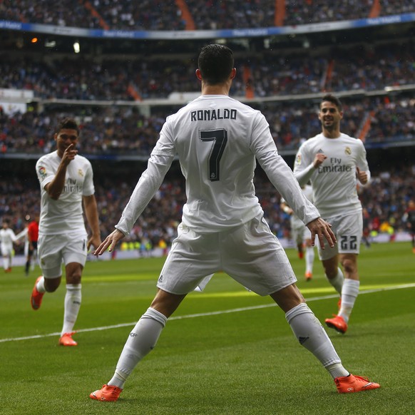 FILE - Real Madrid&#039;s Cristiano Ronaldo celebrates with teammates after scoring a goal against Celta during a Spanish La Liga soccer match between Real Madrid and Celta Vigo at the Santiago Bernab ...
