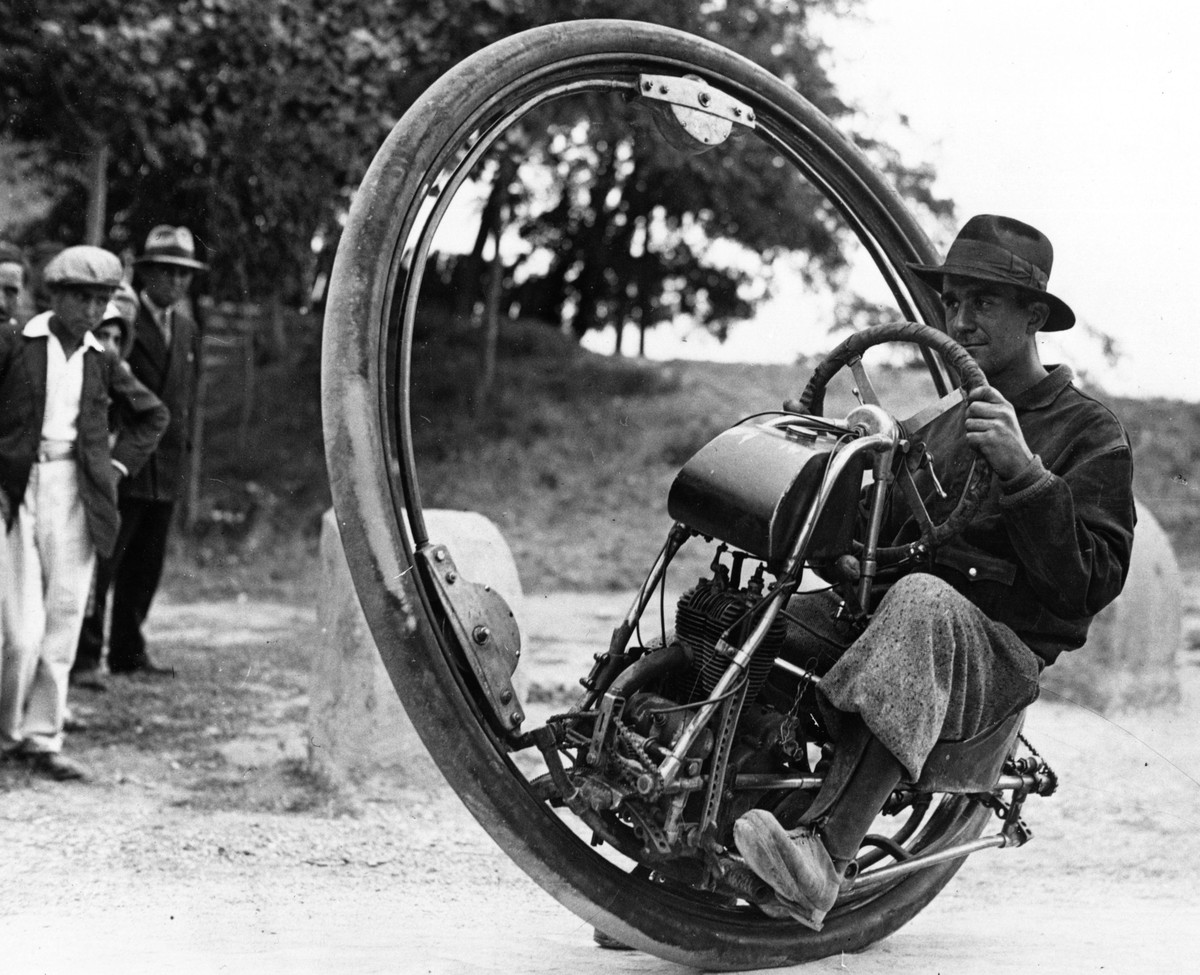 1st September 1931: Swiss engineer M Gerder at Arles, France on his way to Spain in his 'Motorwheel', a motorcycle with a wheel which runs on a rail placed inside a solid rubber tyre. http:/ ...