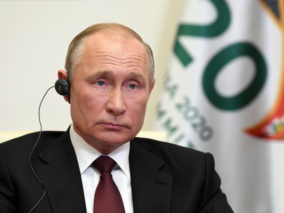 Russian President Vladimir Putin attends the G20 summit hosted by Saudi Arabia via video conference at the Novo-Ogaryovo residence outside Moscow, Russia, Saturday, Nov. 21, 2020. (Alexei Nikolsky, Sp ...