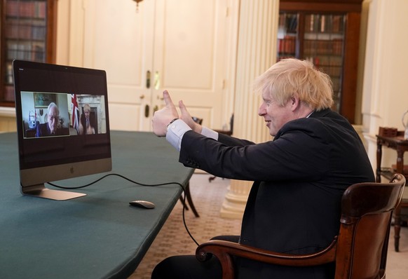 epa08410308 A handout photo made available by n 10 Downing street shows Britain's Prime Minister Boris Johnson video chating with WWII veteran Ernie Horsfall, 102,  from the cabinet room in n10 Downing street in London, Britain 08 May 2020. Ernie served in the Army from 1940 to 1946 as part of the Royal Electrical and Mechanical Engineers (REME)  EPA/ANDREW PARSONS / HANDOUT This image is for Editorial use purposes only. The Image can not be used for advertising or commercial use. The Image can not be altered in any form. Credit should read Andrew Parsons/n10 Downing street. HANDOUT EDITORIAL USE ONLY/NO SALES
