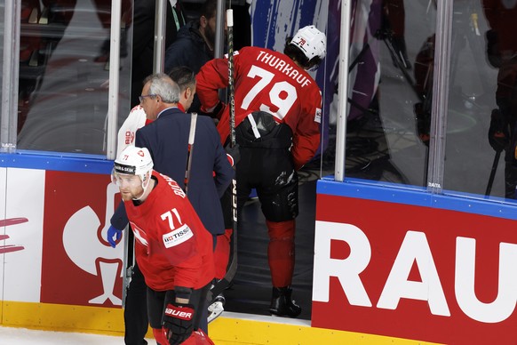 Switzerland&#039;s forward Calvin Thuerkauf injured leaves the rink, during the IIHF 2023 World Championship preliminary round group B game between Norway and Switzerland, at the Riga Arena, in Riga,  ...